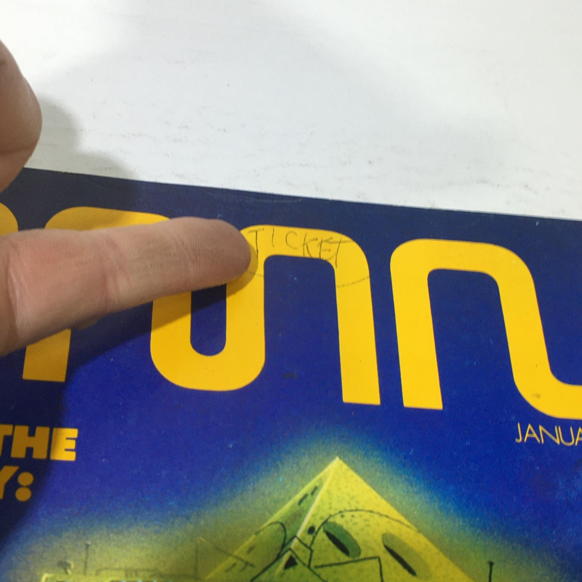 Close-up of the Omni Magazine January 1980 cover showing a handwritten note 'TICKET' near the logo, highlighting vintage wear.