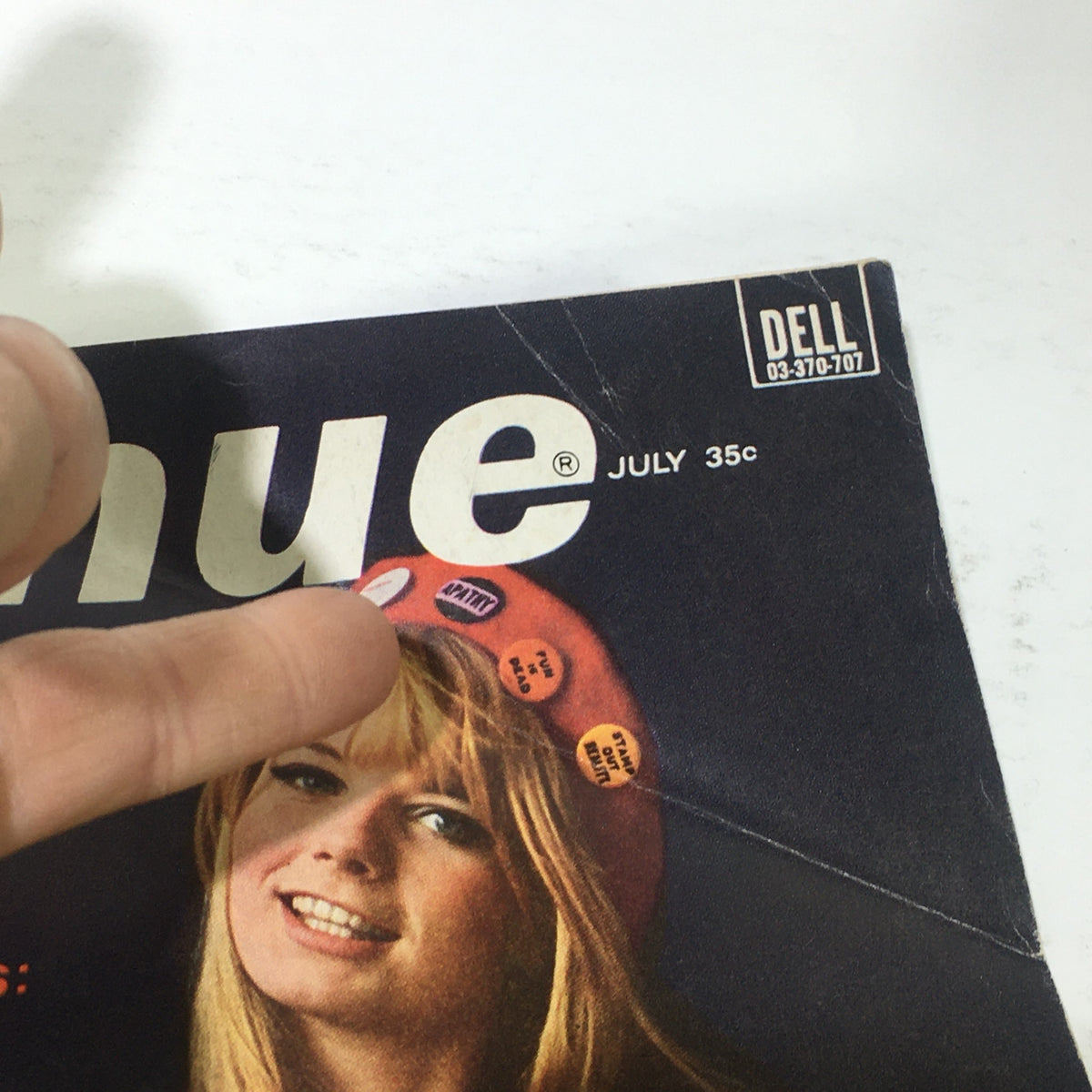 Close-up of the cover of VTG Ingenue Magazine: July 1967 highlighting the title and date along with a model's face adorned with stylish buttons.