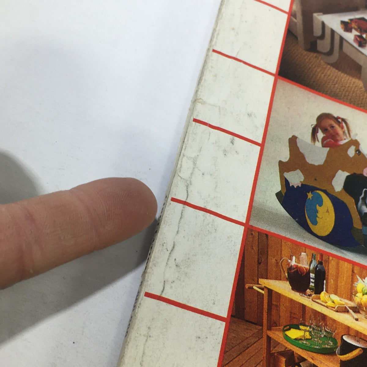 Detailed shot of the edge of the VTG Better Homes and Gardens Catalog: July 1981 focusing on a decorative wooden ride-on toy and other home decor projects.