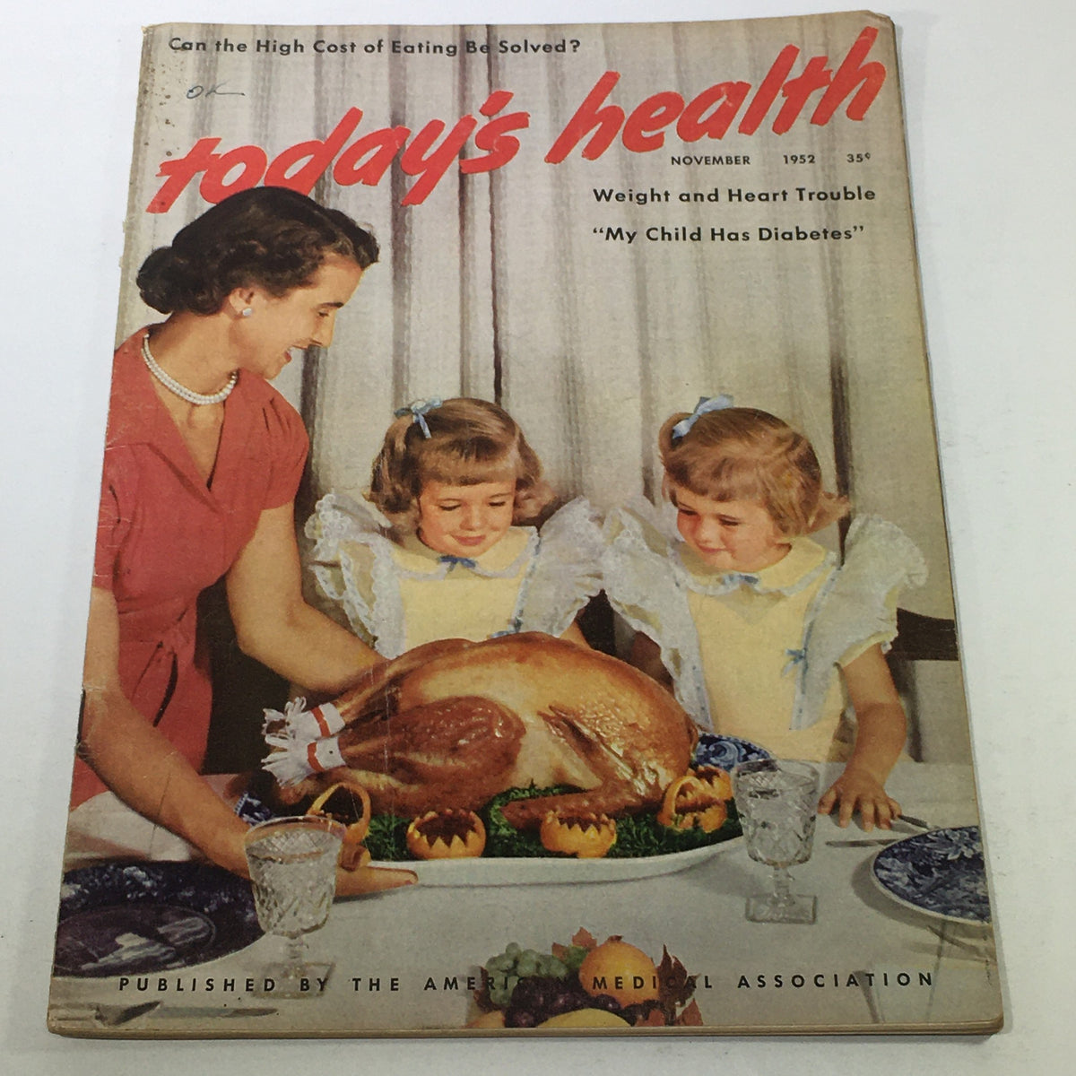 Cover of VTG Today's Health Magazine: November 1952 featuring a woman and two children admiring a Thanksgiving turkey dinner, focusing on health topics such as weight and heart trouble.