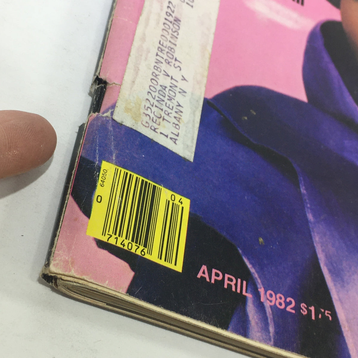 Detailed angle of the back cover of Ebony Magazine April 1982, showcasing the magazine's barcode and wear signs, emphasizing its vintage status.