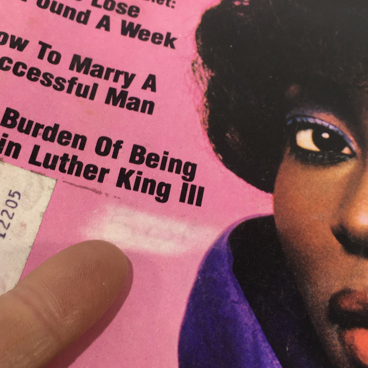 Close-up view of the magazine cover of Ebony Magazine April 1982, highlighting a section of text including 'How To Marry A Successful Man' and 'The Burden Of Being Martin Luther King III'.