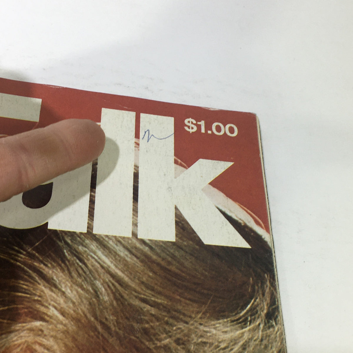 Close-up view of the November 1976 Talk Magazine cover, showcasing Farrah Fawcett Majors with a visible price tag of $1.00 and minor wear signs, emphasizing its vintage appeal.