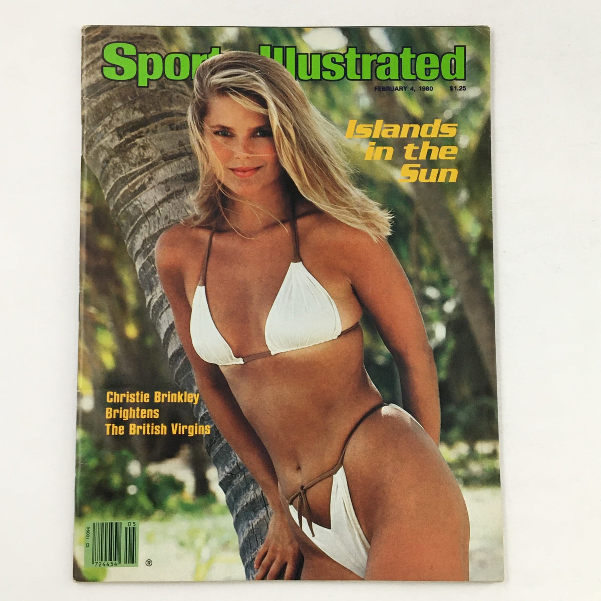Cover of Sports Illustrated Swimsuit Magazine February 4, 1980 featuring Christie Brinkley in a white bikini, photographed in a tropical setting with palm trees.