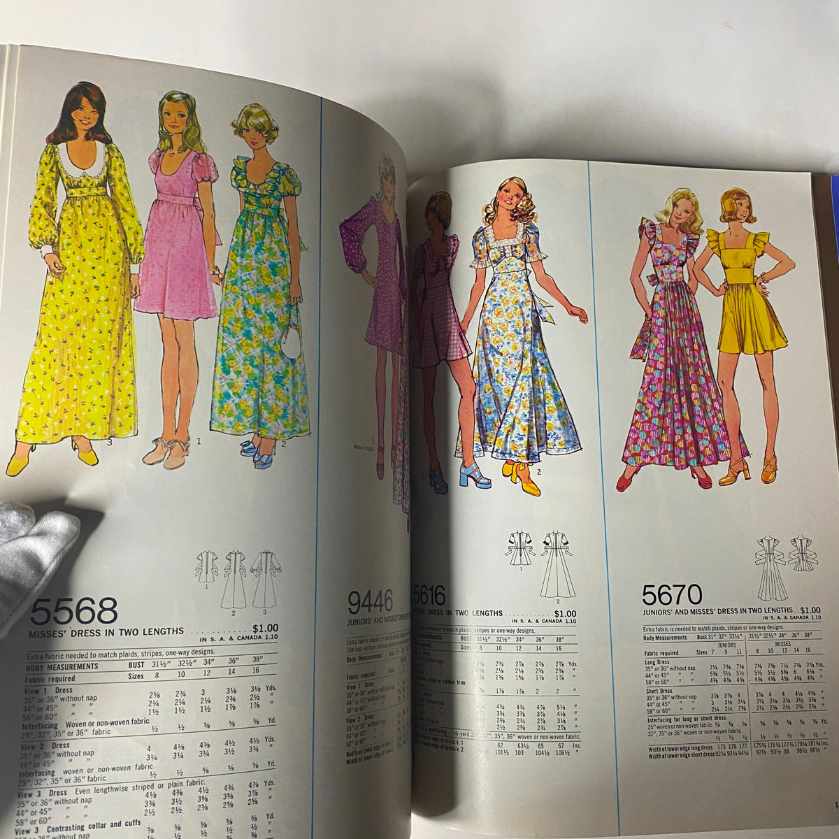 1973 Simplicity Fall and Winter School Catalog featuring sewing patterns for dresses in various lengths and styles, including patterns 5568, 9446, 5616, and 5670 with colorful floral designs.