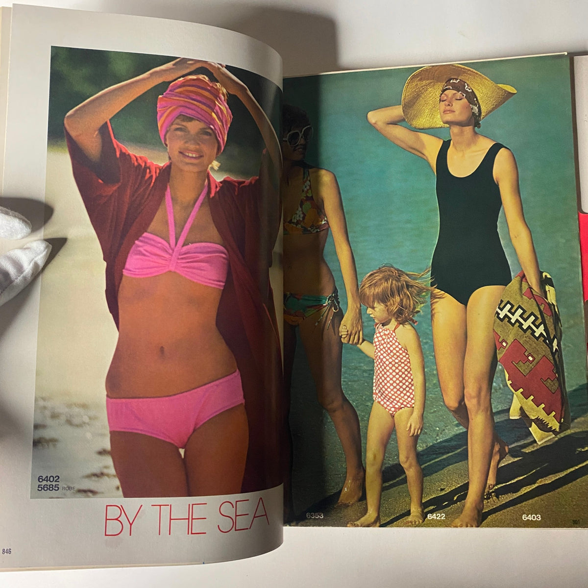 1974 July Simplicity Summer Catalog featuring a beach scene with women in vintage swimwear, showcasing summer fashion trends from the 1970s.