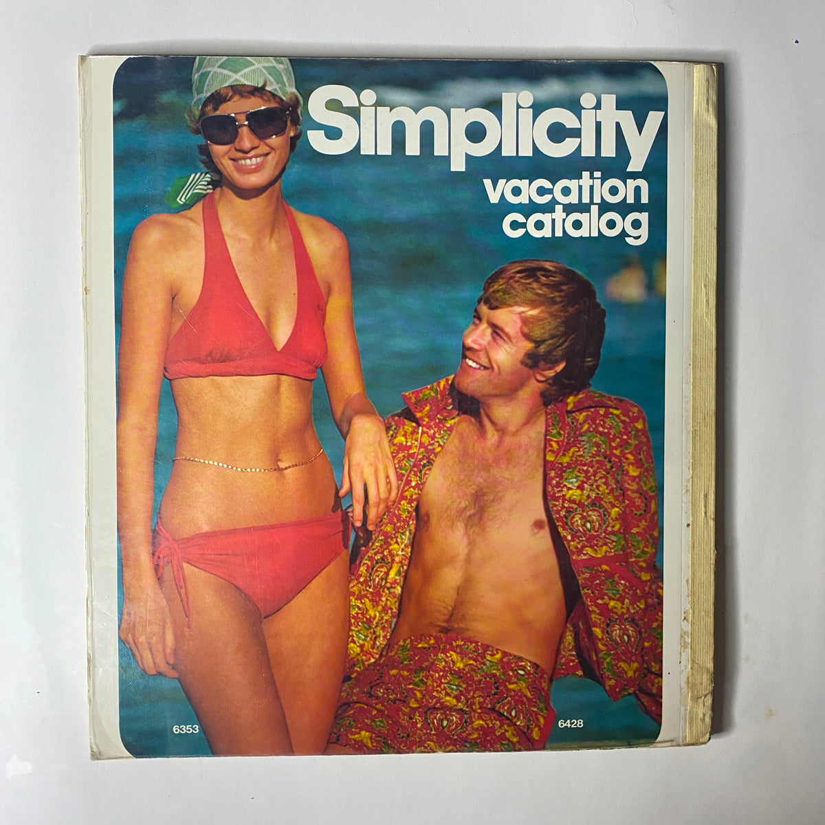 1974 Simplicity Summer Catalog featuring models in vintage swimwear on the cover, promoting relaxed mid-1970s summer styles.