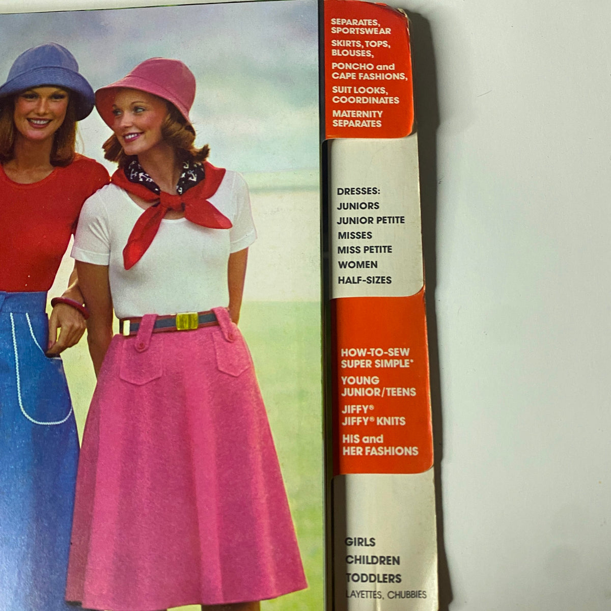 Close-up of the 1975 Simplicity Special Catalog cover showcasing two women in colorful outfits, emphasizing separates, sportswear, and fashionable sewing patterns.