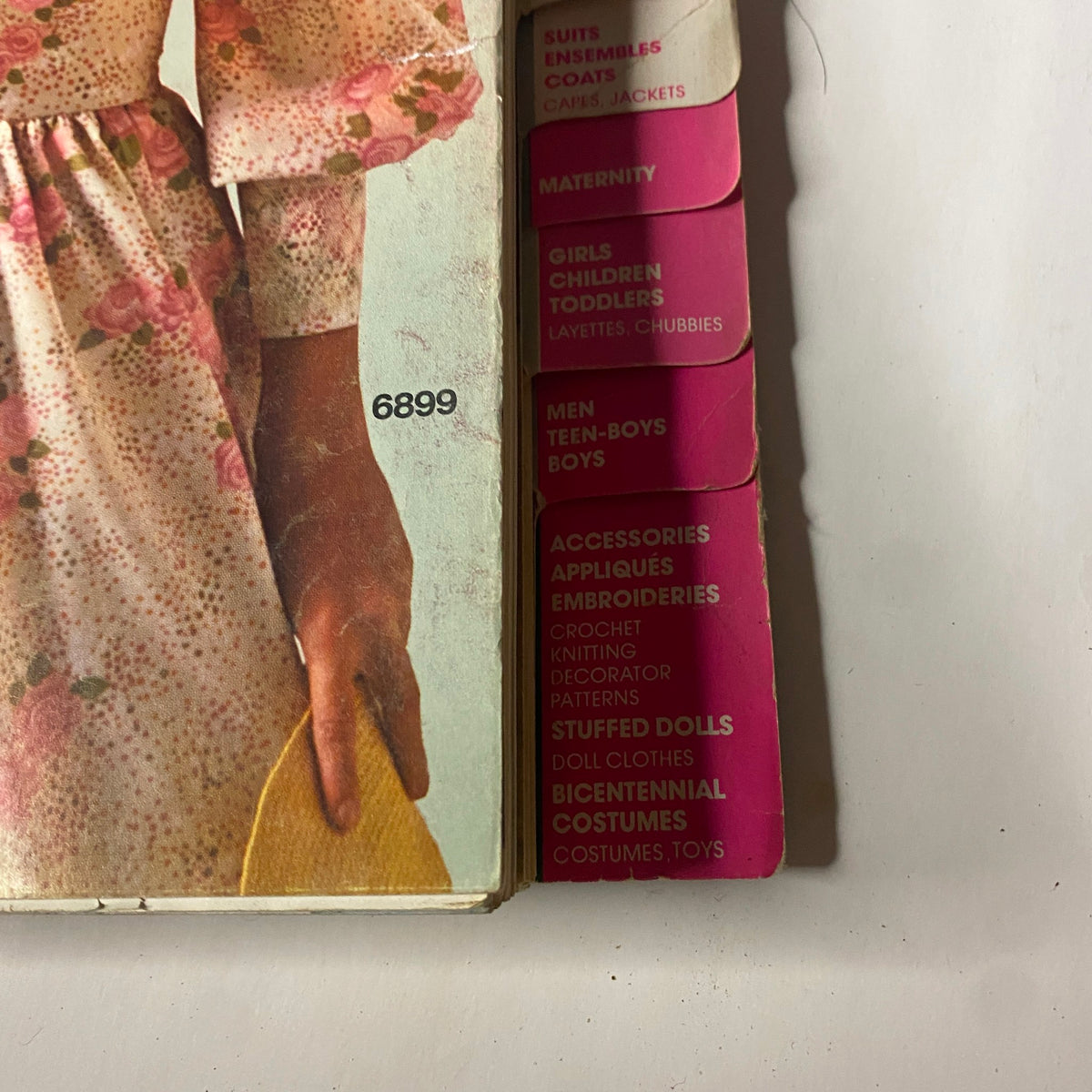 1975 June Simplicity Catalog Sewing Pattern showcasing a themed section for women’s dresses and coats with a floral design highlighted, part of the vintage collection.