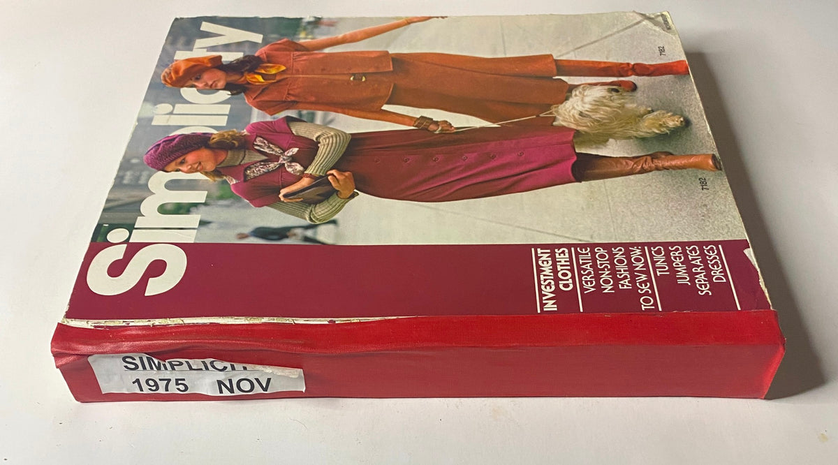 1975 November Simplicity Catalog showing a sewing pattern for investment clothes, featuring two models in fashionable outfits on the cover.