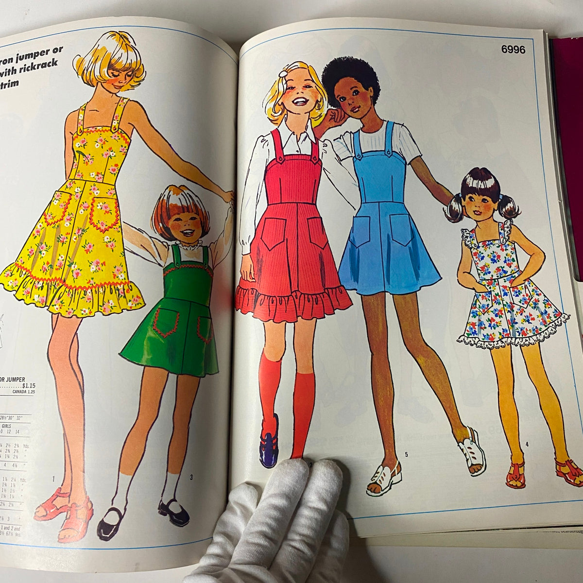 1975 November Simplicity Catalog presenting children’s fashion patterns for jumpers and dresses, showcasing vibrant designs suitable for young girls.