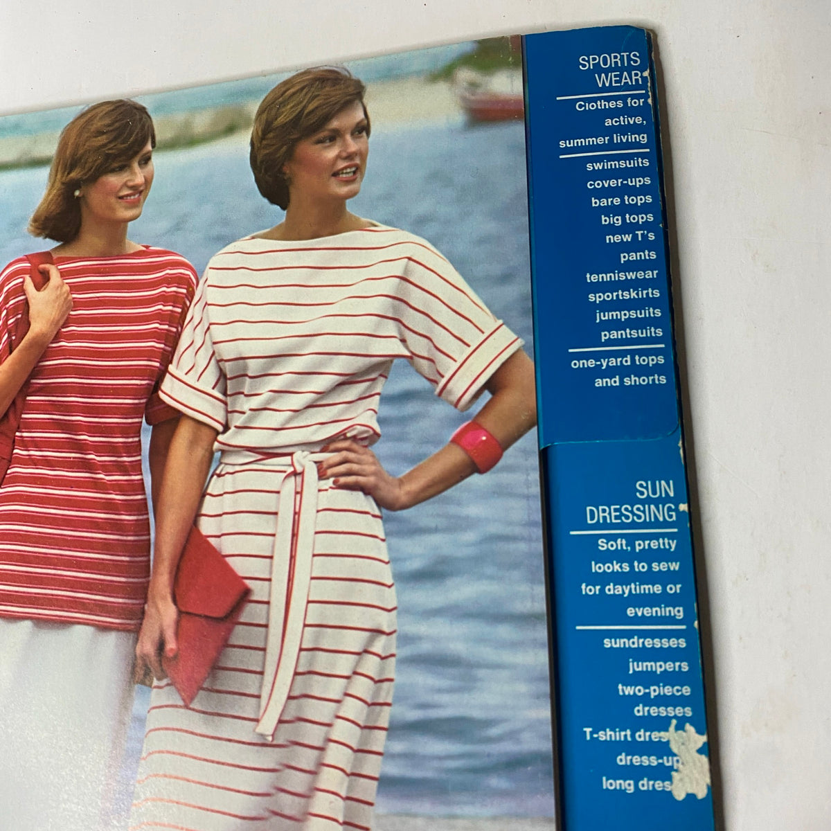 Inside layout of the 1976 Simplicity Sportswear Catalog highlighting the 'Sports Wear' and 'Sun Dressing' sections, featuring styles such as swimsuits and sundresses.