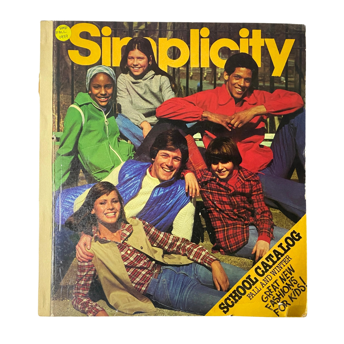 Cover of the 1977 Simplicity Fall Catalog showcasing diverse group of children and teens in vibrant fashion. The catalog is titled '1977 Simplicity Fall Catalog Sewing Pattern Store Counter Book Fashion Sewing' with a focus on great new fashions for kids.