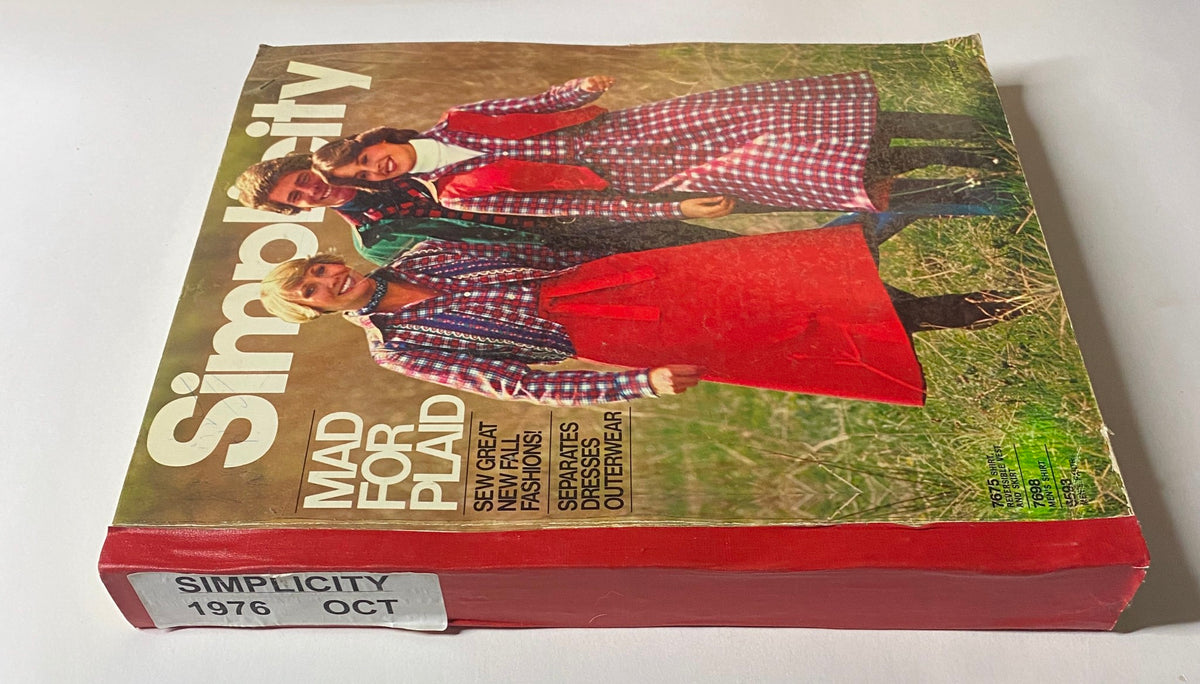 Side view of the 1976 October Simplicity Sewing Pattern Catalog highlighting the plaid design and text label indicating the catalog's date and theme 'Mad for Plaid'.