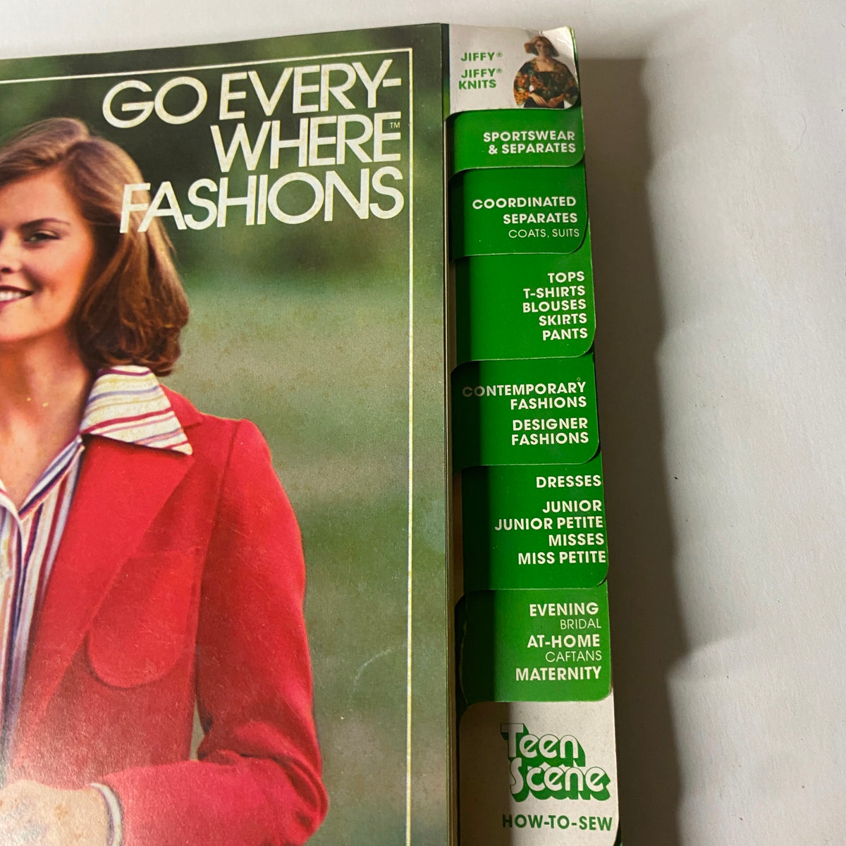 Close-up of the 1977 April Simplicity Sewing Pattern Catalog showcasing the tabbed sections for various fashion patterns including sportswear and separates.