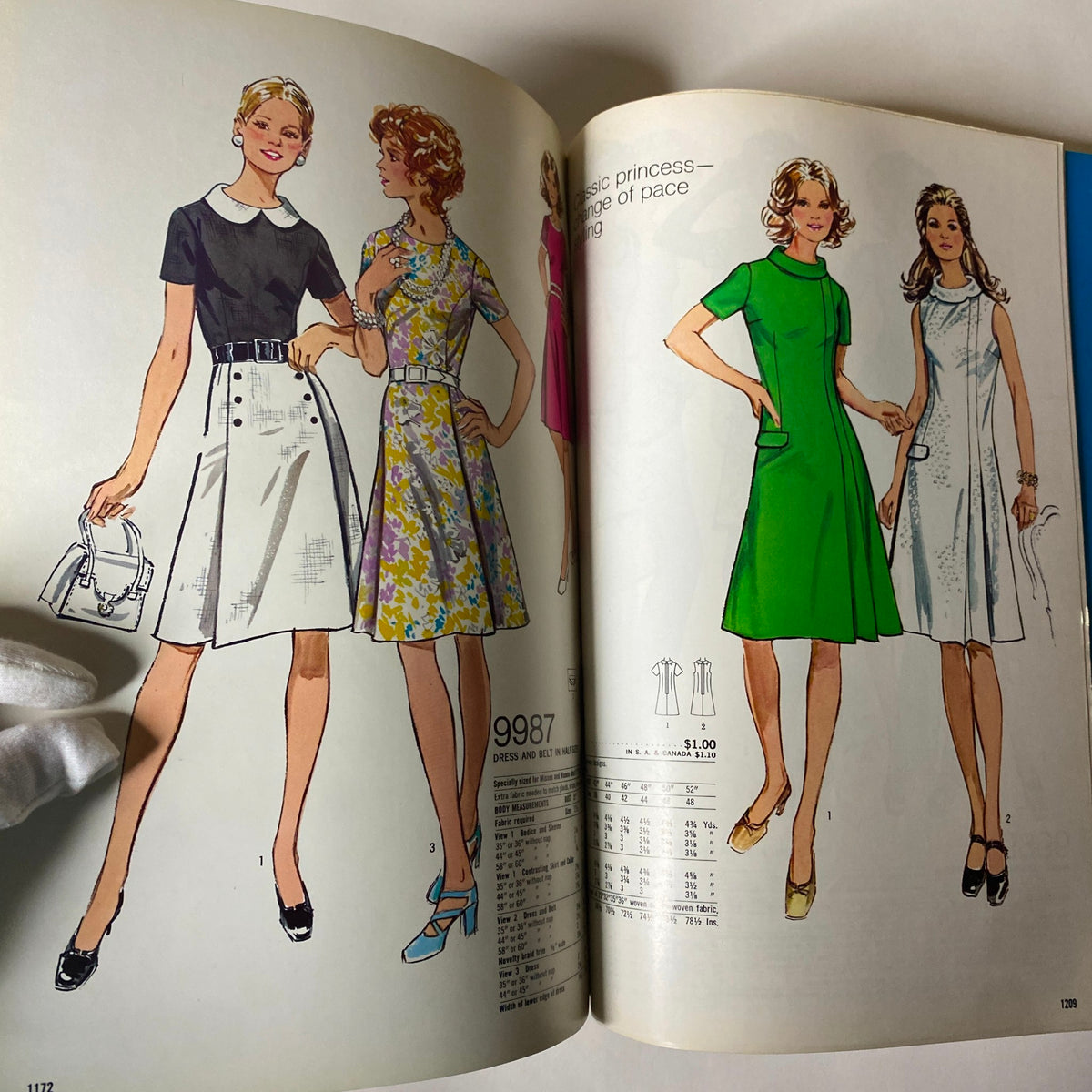 1970s May Simplicity Sewing Pattern Catalog featuring classic dresses with princess seams and button details, representing vintage fashion styles.