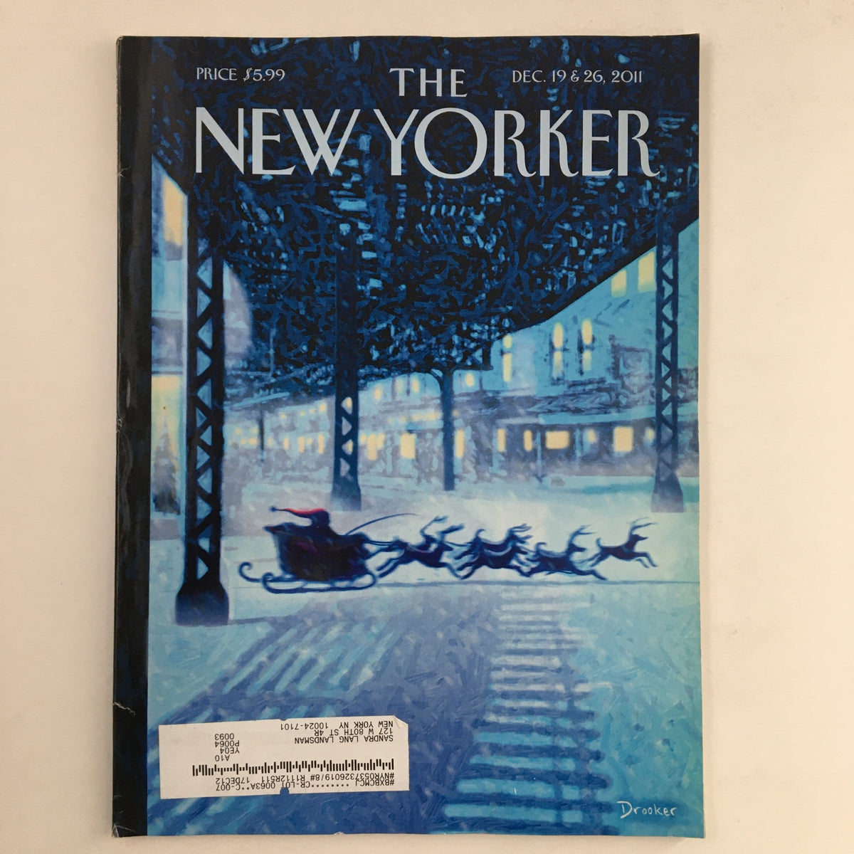 The New Yorker December 19 2011 Full Magazine cover, featuring the iconic theme art by Eric Drooker, depicting a serene winter scene with sleighs and dogs set against a colorful urban backdrop.