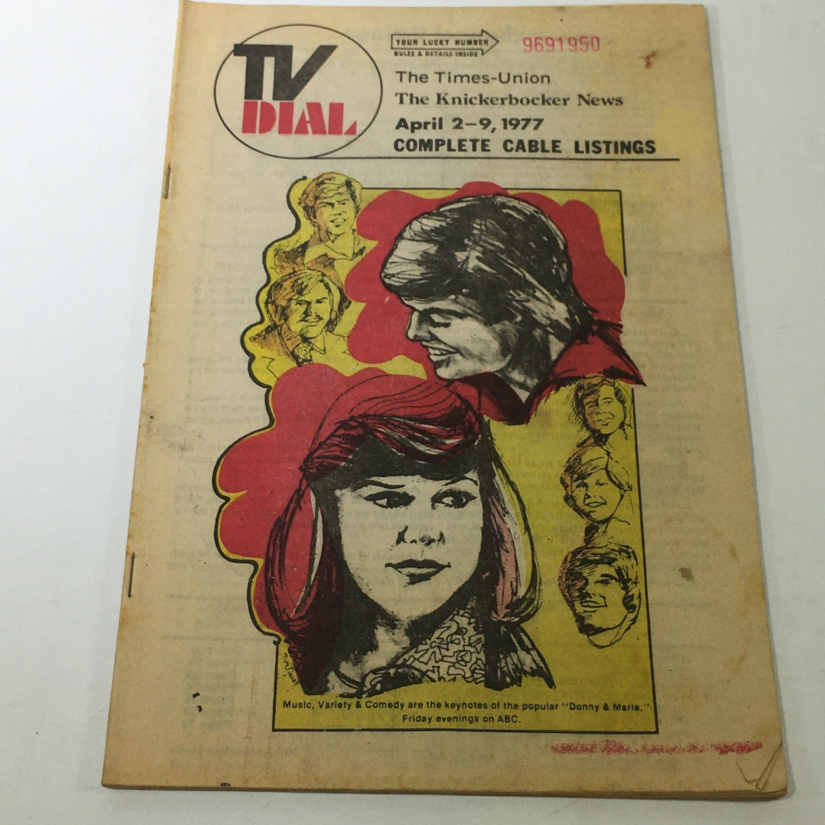 VTG TV Dial Complete Cable Listings April 2-9 1977 featuring a colorful cover illustration of the popular TV show 'Donny & Marie' with prominent portraits of the duo.
