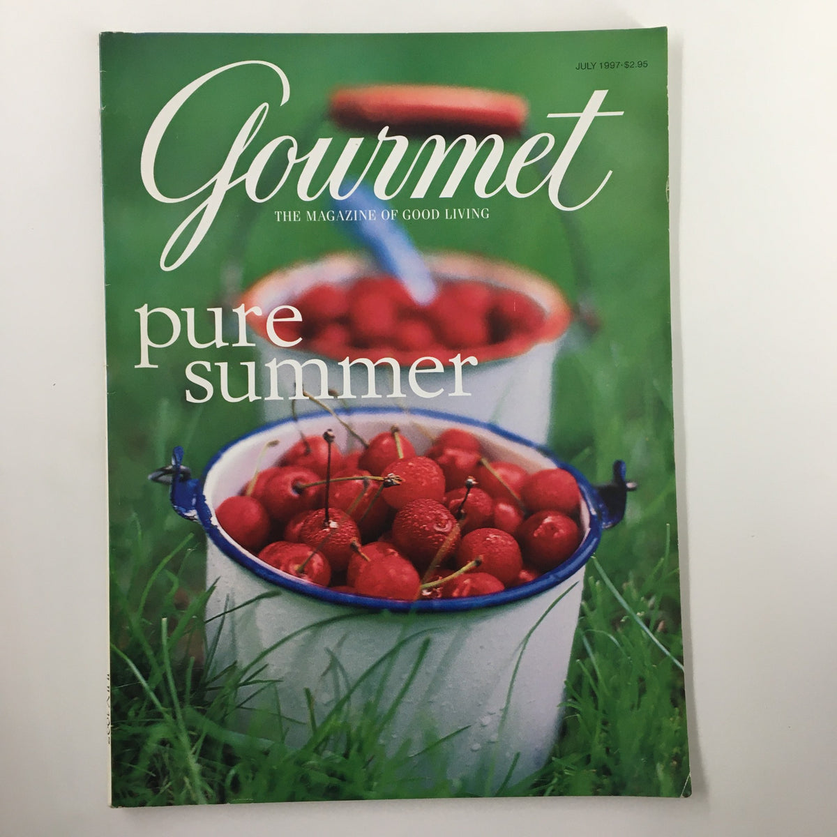 Cover of Gourmet Magazine July 1997 featuring the title 'Gourmet' and the subtitle 'pure summer' with an image of red cherries in white buckets on a grassy background.