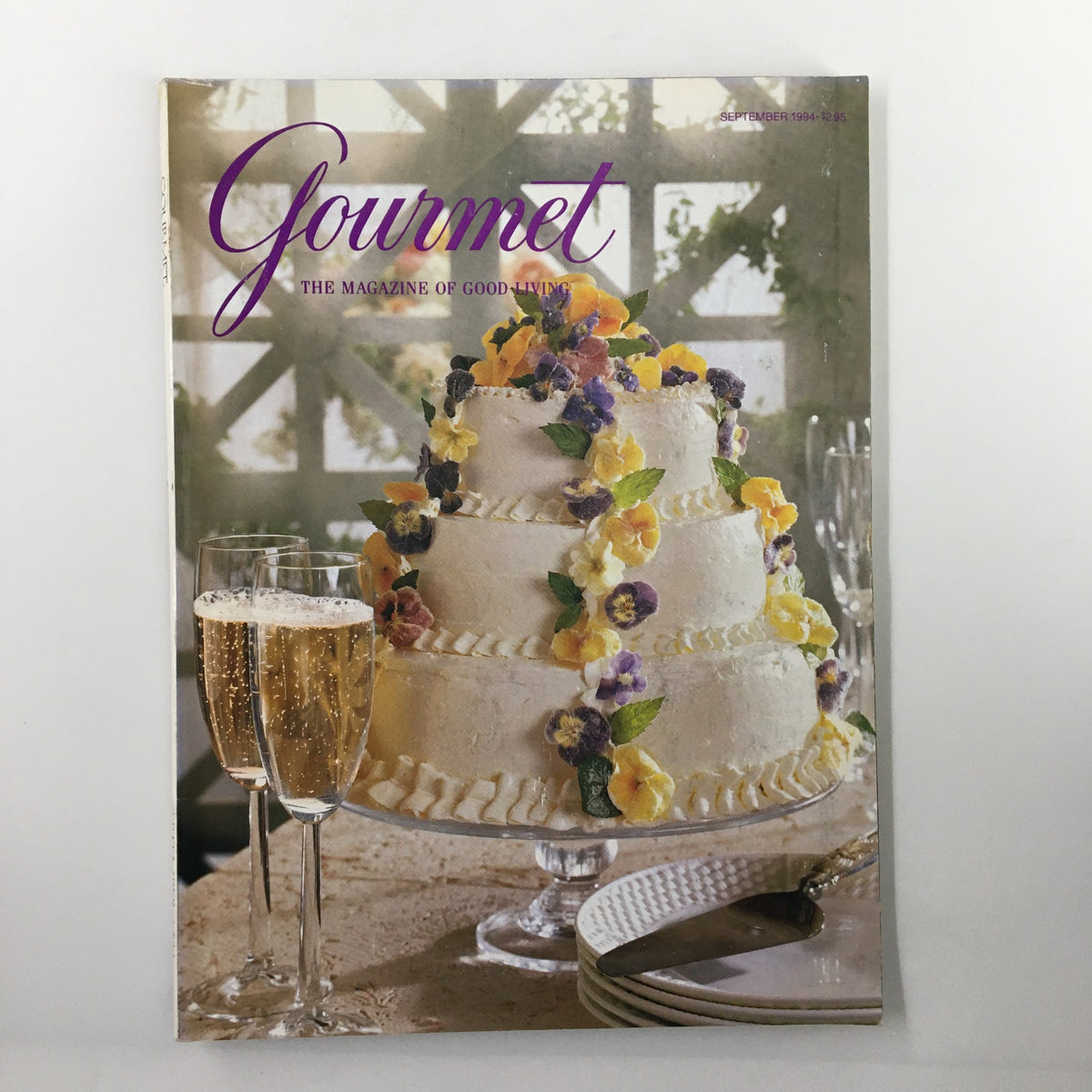 Gourmet Magazine September 1994 featuring an elegant Lemon Raspberry Wedding Cake on the cover, adorned with colorful edible flowers and served with two glasses of sparkling wine.