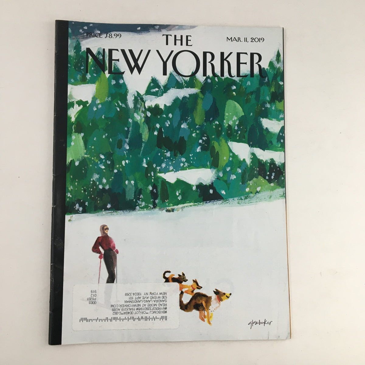 The New Yorker Full Magazine Cover March 11 2019 featuring 'Off The Beaten Path' artwork by Gayle Kabaker. The cover showcases a snowy landscape with a figure and two dogs, reflecting modern storytelling and artistic design.