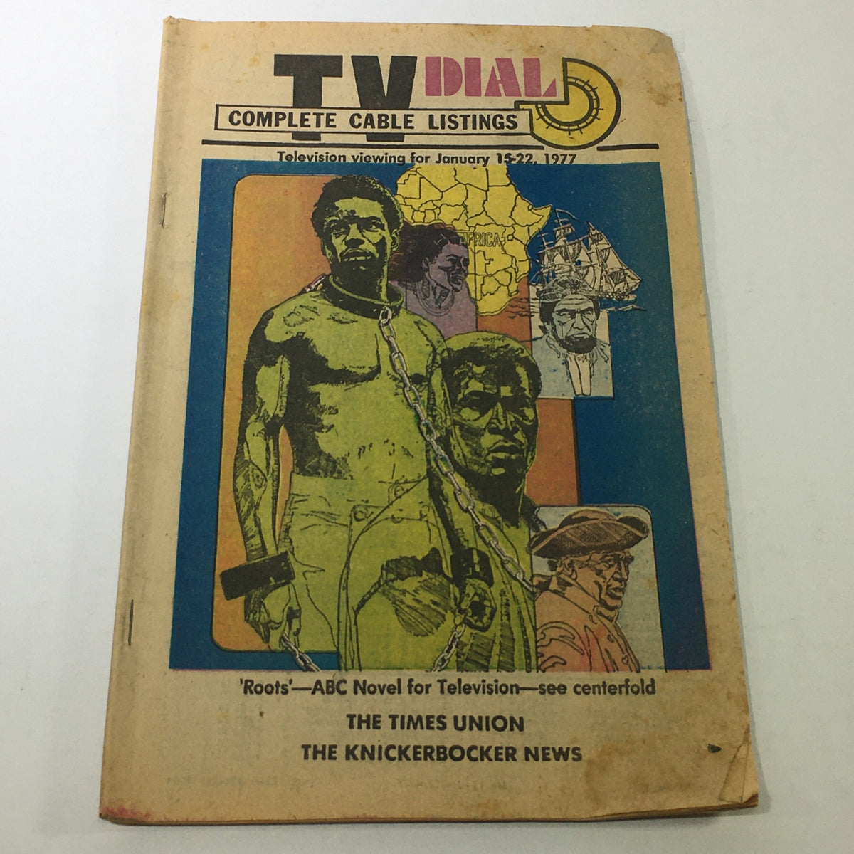 VTG TV Dial Complete Cable Listings January 15-22 1977, featuring the ABC Novel 'Roots'. The cover showcases a colorful illustration depicting a character associated with the series, with text emphasizing television viewing for the specified dates.