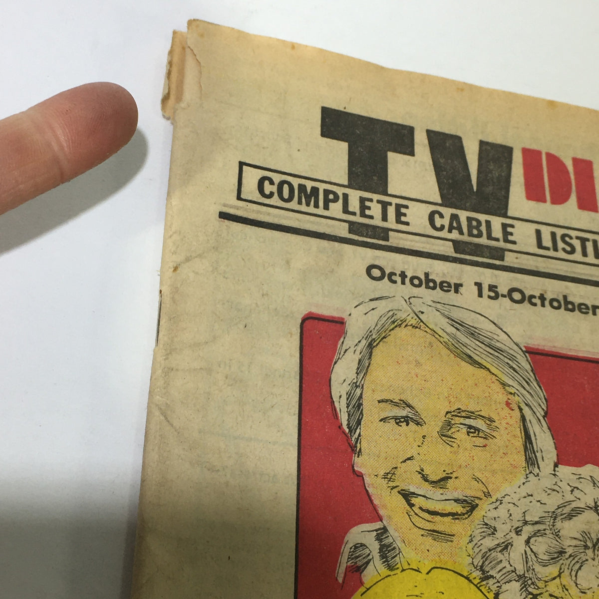 Close-up of the VTG TV Dial Complete Cable Listings October 15-22 1977 magazine cover, highlighting the title and illustrations of the Three's Company cast with visible wear and tear.
