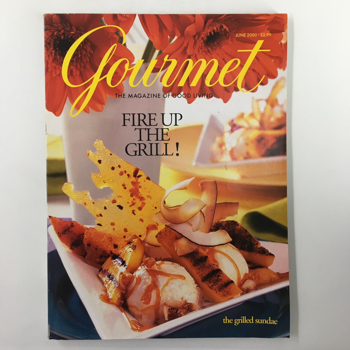 Gourmet Magazine June 2000 cover featuring a colorful presentation of grilled fruit and dessert titled 'Fire Up the Grill!' This issue is centered around a tropical-fruit split, perfect for Father's Day celebrations.