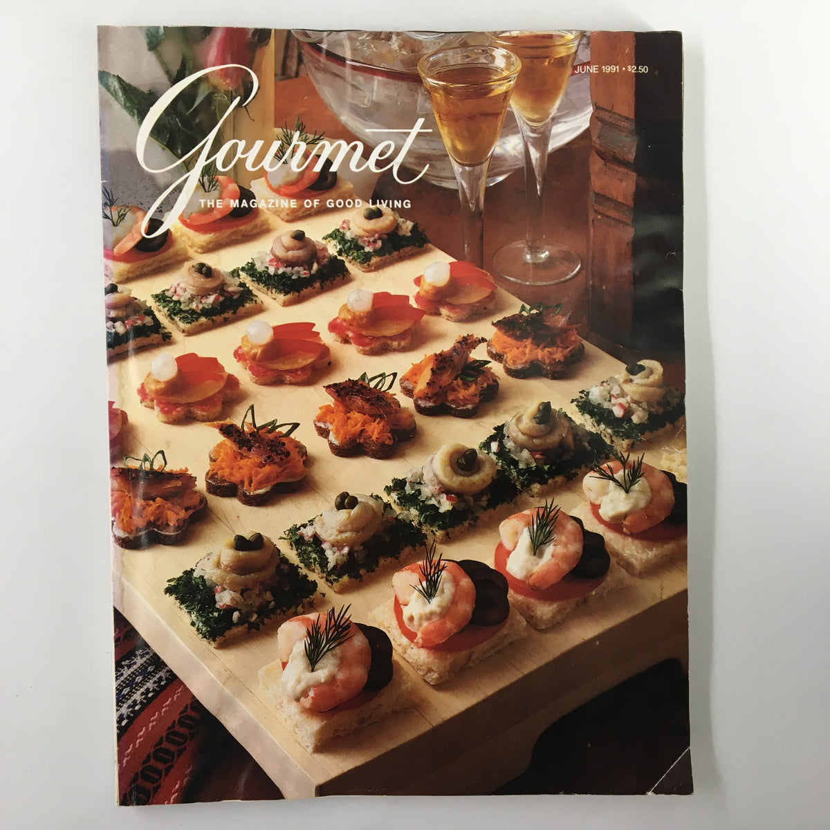 Gourmet Magazine June 1991 cover featuring an elegant display of hors d'oeuvres on a wooden platter, showcasing the culinary excellence celebrated in the issue.