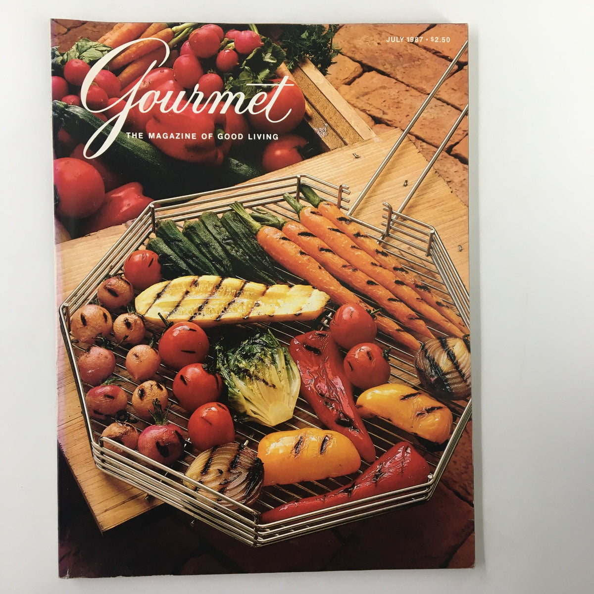 Cover of VTG Gourmet Magazine July 1987 featuring grilled vegetables and the title 'Gourmet: The Magazine of Good Living.' This edition focuses on gourmet menus perfect for family reunions.