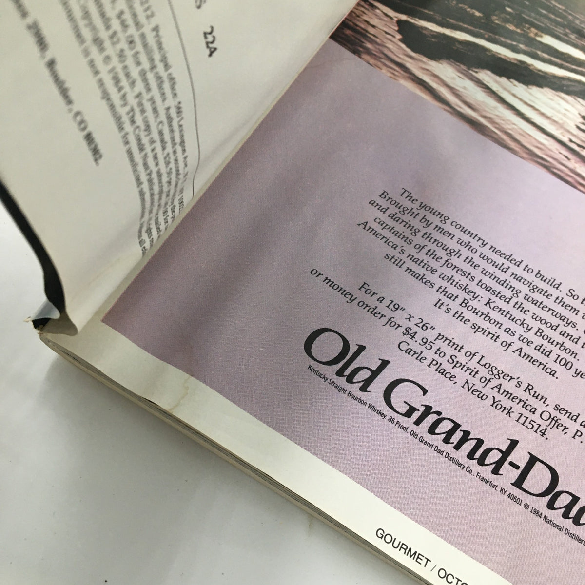 Part of Gourmet Magazine October 1984 showing a page with an advertisement for Old Grand-Dad bourbon whiskey.