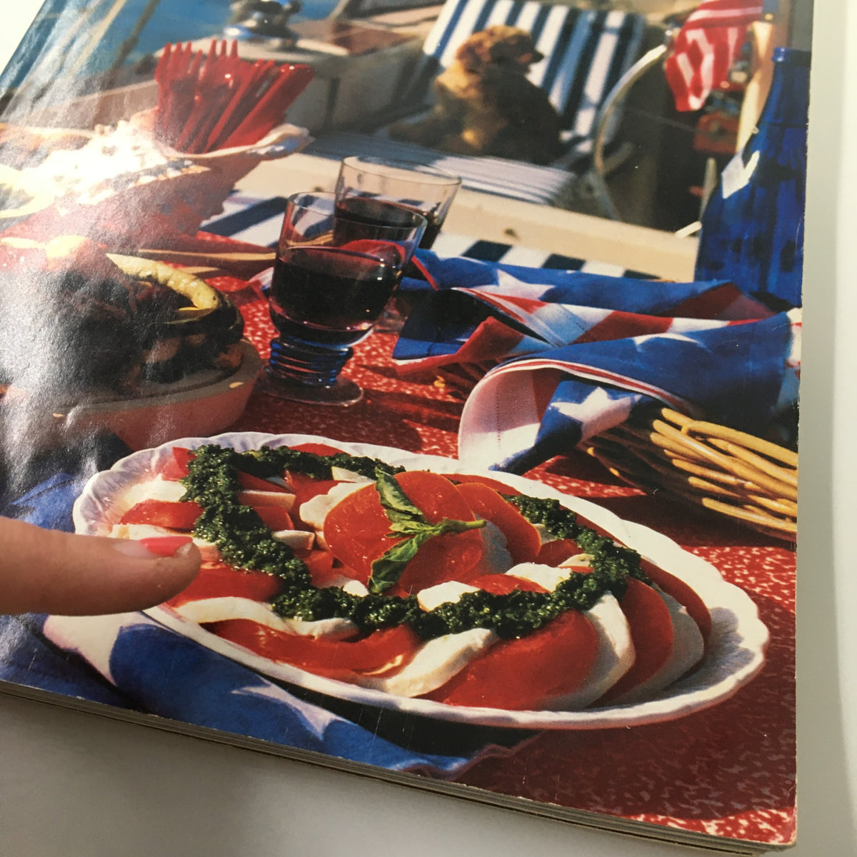 Gourmet Magazine May 1994 Wine Journal featuring a summer dining scene with a delectable salad surrounded by wine glasses and red, white, and blue décor.