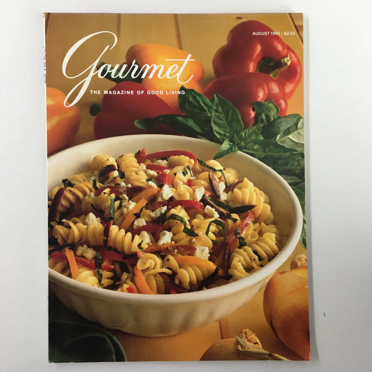 Cover of Gourmet Magazine August 1990 featuring a vibrant pasta salad with bell peppers, garnished with fresh basil. The magazine's title, 'Gourmet', is prominently displayed. Perfect for food lovers and vintage magazine collectors.