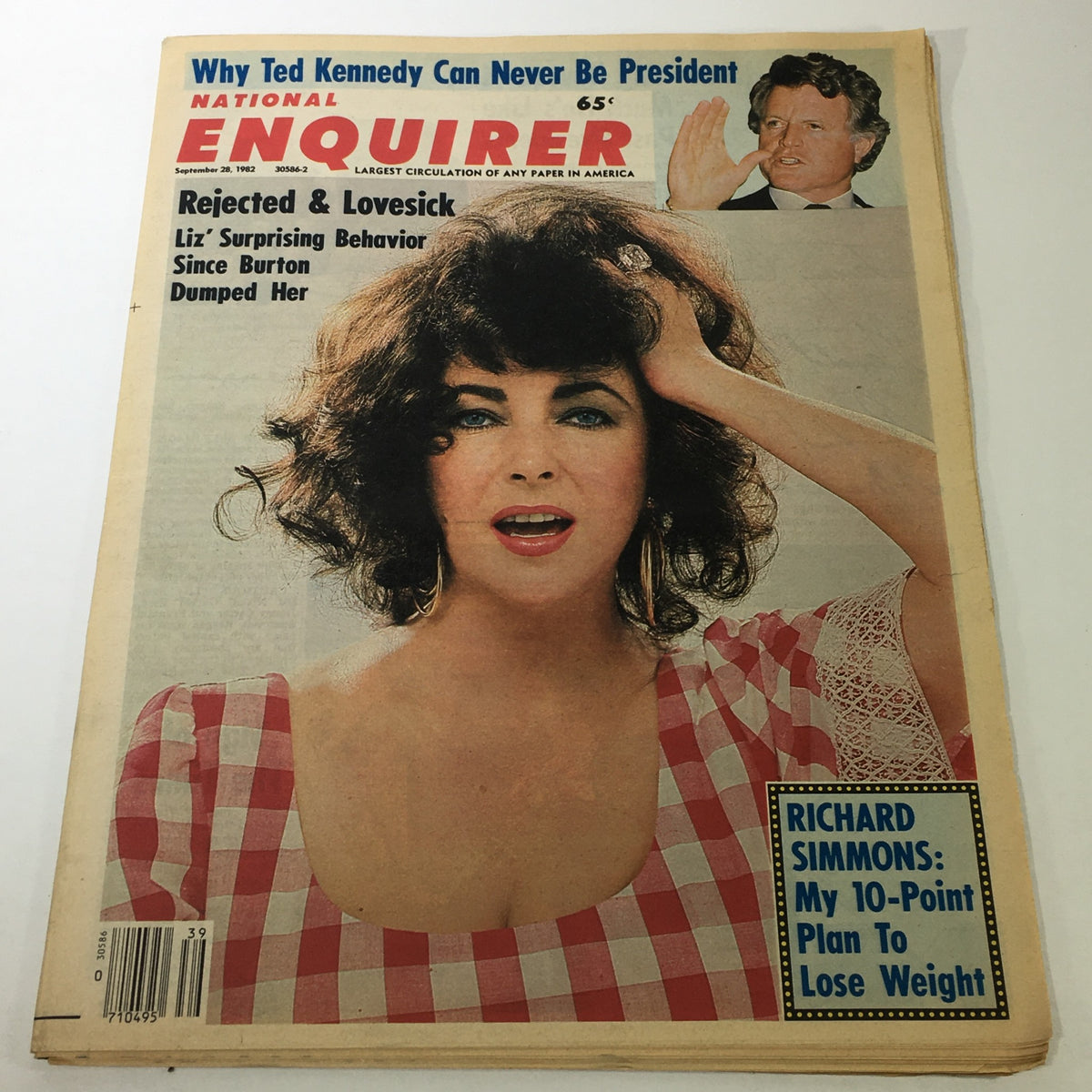 Cover of the National Enquirer Magazine dated September 28, 1982 featuring Liz Taylor with a surprised expression, wearing a red and white checkered dress. The magazine also includes the headline 'Why Ted Kennedy Can Never Be President' along with a photo of Ted Kennedy. This vintage magazine is a collectible piece of pop culture history.