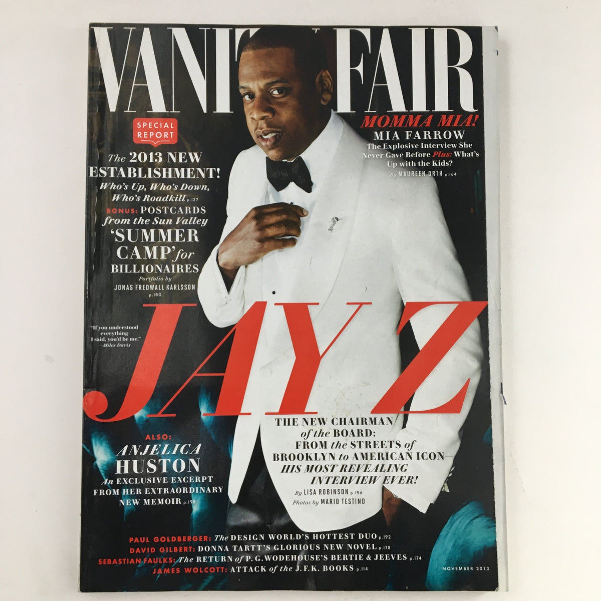Cover of Vanity Fair Magazine November 2013 featuring rapper Jay Z in a tuxedo and actress Anjelica Huston, highlighting pop culture and celebrity insights.
