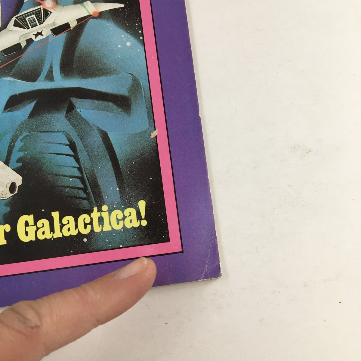 Close-up image of Dynamite Magazine #54 featuring the title 'The Secrets of Battlestar Galactica' along with a spaceship.
