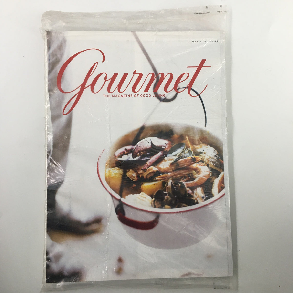 Gourmet Magazine May 2007 cover featuring a bowl of seafood dish, showcasing home cooking inspiration from chef Francis, sealed in plastic.