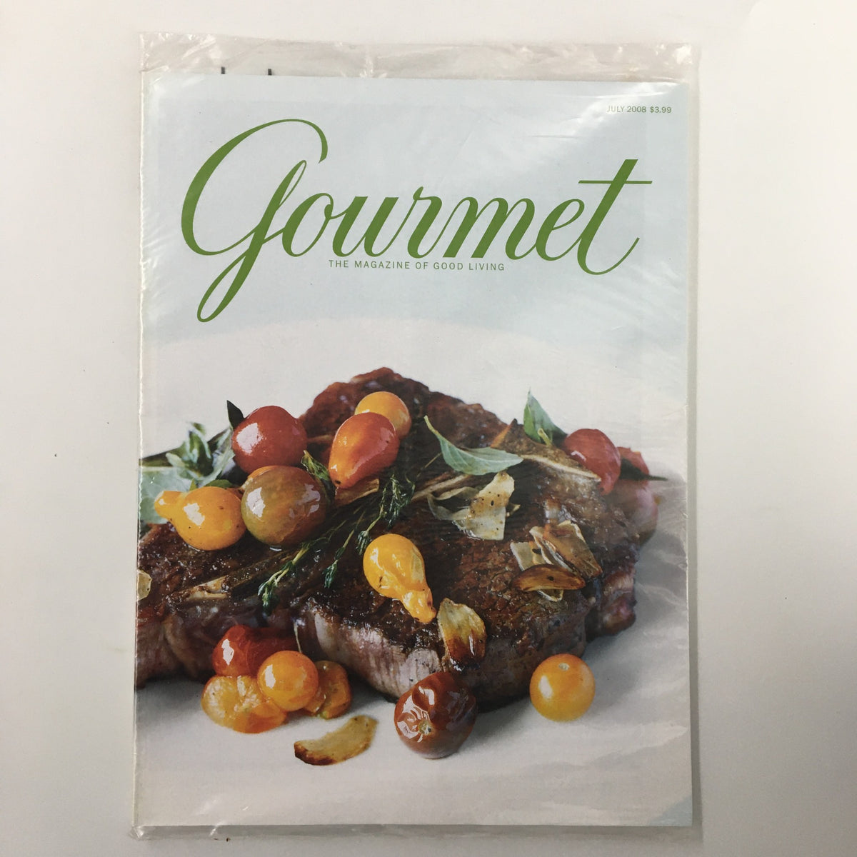 Cover of Gourmet Magazine July 2008 featuring Lisu Spice-Rubbed Roast Pork Recipe, showcasing vibrant tomatoes and herbs.