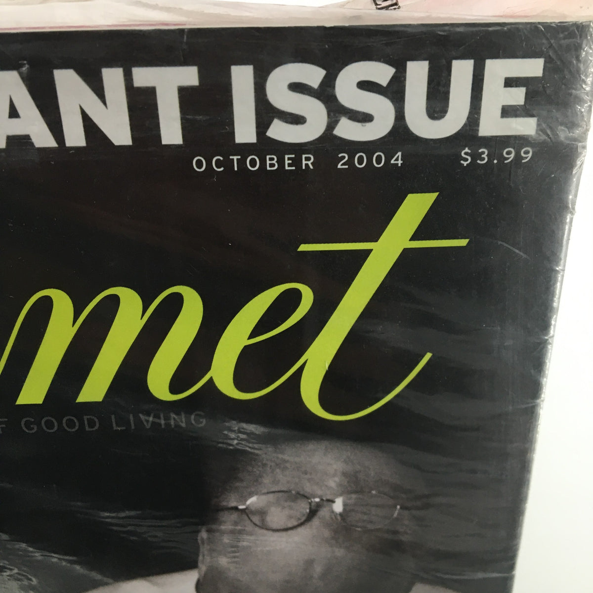 Close-up of the Gourmet Magazine October 2004 title and date, showcasing the sealed condition and focus on the Cider Spice Cake recipe.