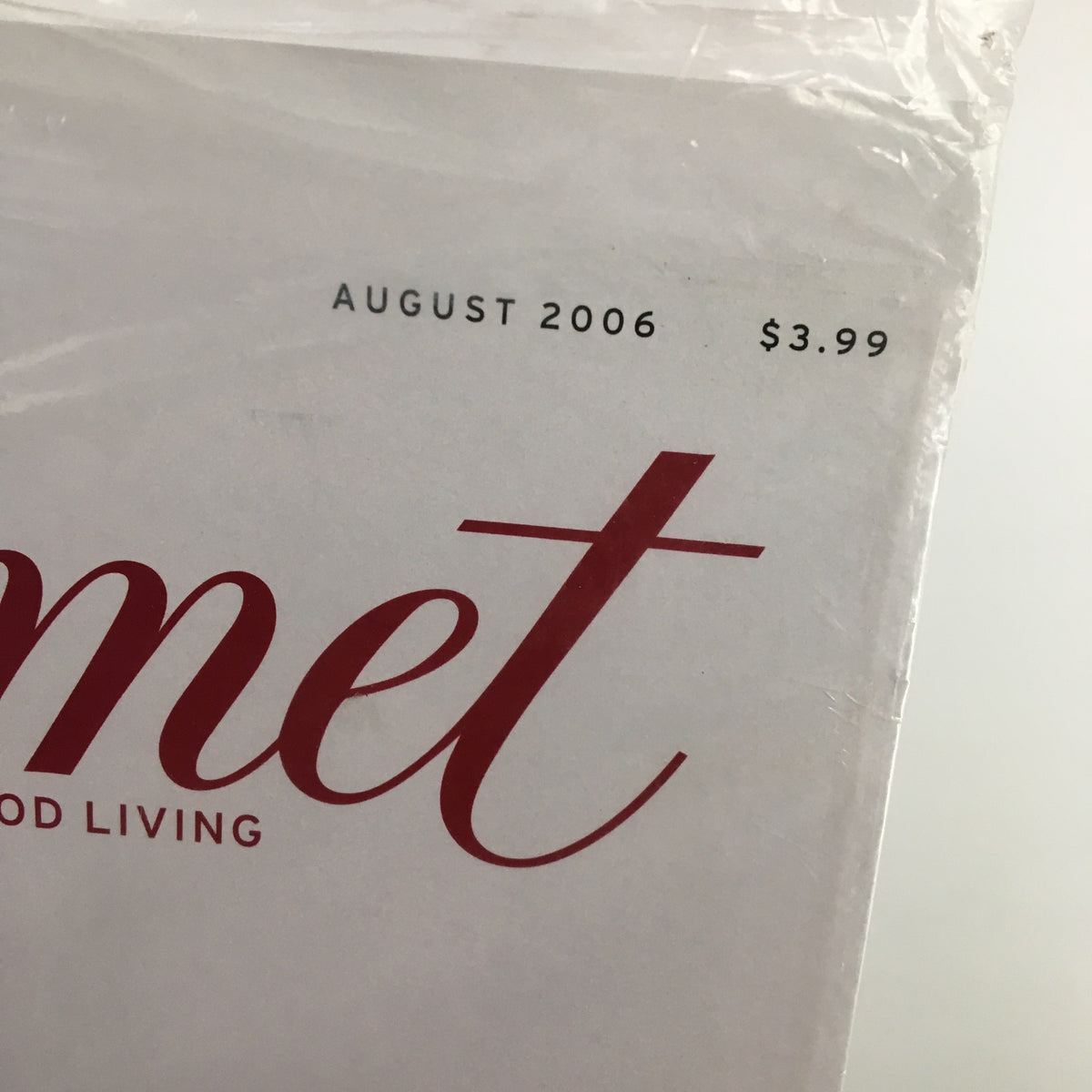 Close-up view of the Gourmet Magazine August 2006 cover featuring the title and price highlight, showcasing the Blueberry Yogurt Pie Recipe. New and sealed condition.