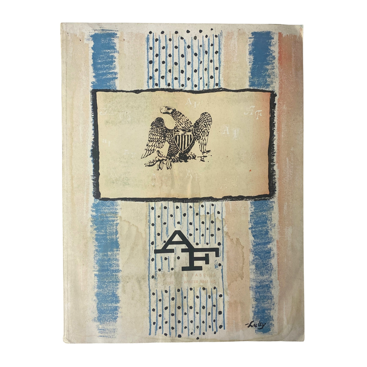 Cover of the 1961-1962 American Fabrics Winter Catalog featuring an eagle emblem, artistic blue and beige stripes, and a classic design reflecting textile culture.