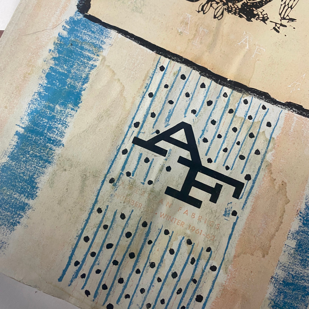 Detailed view of the cover of the 1961-1962 American Fabrics Winter Catalog showcasing the AF logo, polka dot patterns, and mid-century artistic style.