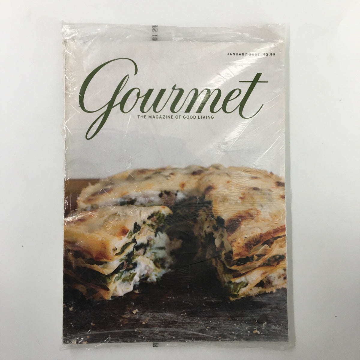 Gourmet Magazine January 2007 cover featuring Baked Eggs in Cream with Spinach, showcasing exquisite layers of spinach and creamy textures, sealed in original packaging.
