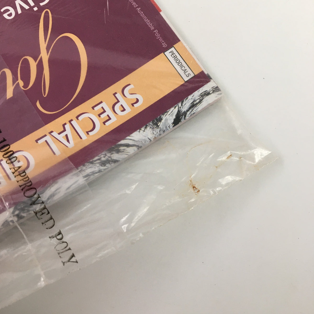 Close-up of the plastic wrapping of Gourmet Magazine July 2005, depicting the seal and part of the cover indicating its collectible value.