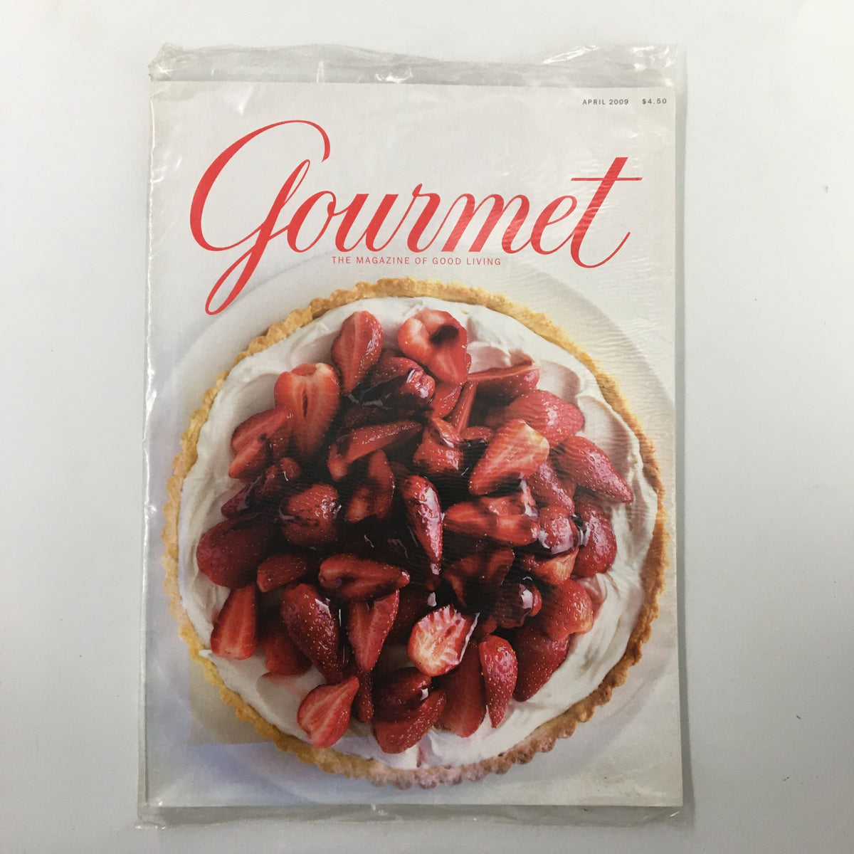 Gourmet Magazine April 2009 issue featuring a Strawberry Mascarpone Tart with Port Glaze on the cover. This vintage magazine is sealed, making it a collectible item for culinary enthusiasts.