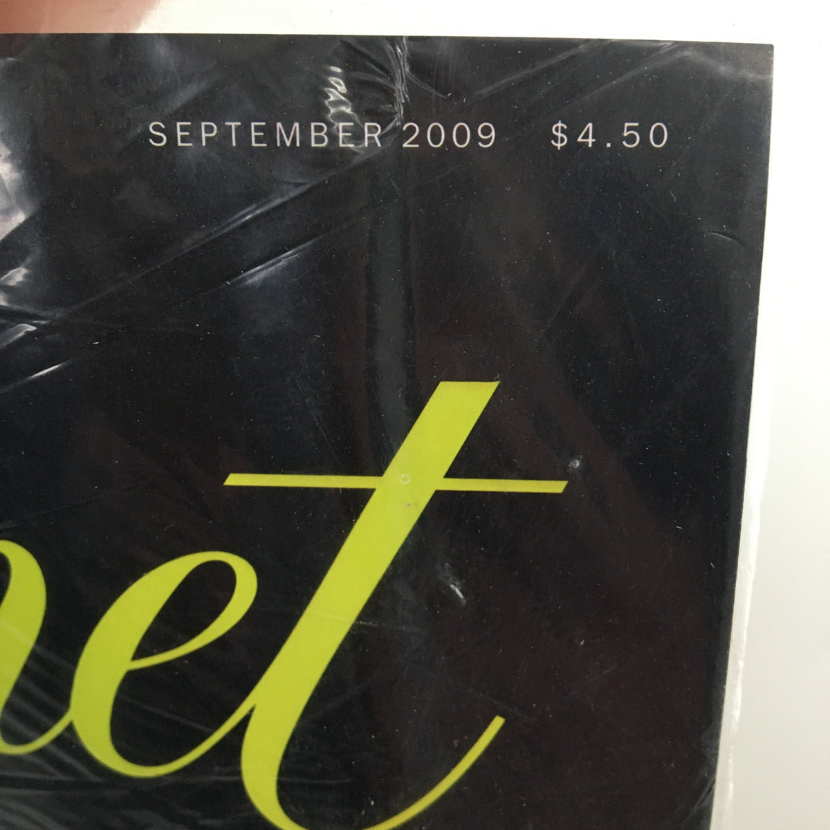 Image capturing the top of the pristine September 2009 Gourmet Magazine, displaying the date and price tag, emphasizing its collectible nature as a part of culinary history.