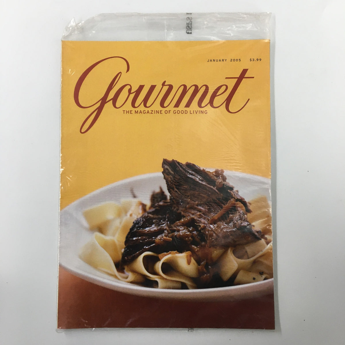 Cover of Gourmet Magazine January 2005 featuring a dish of pasta with braised meat, highlighting the culinary theme of the issue and the Mandarin Orange Napoleons recipe.