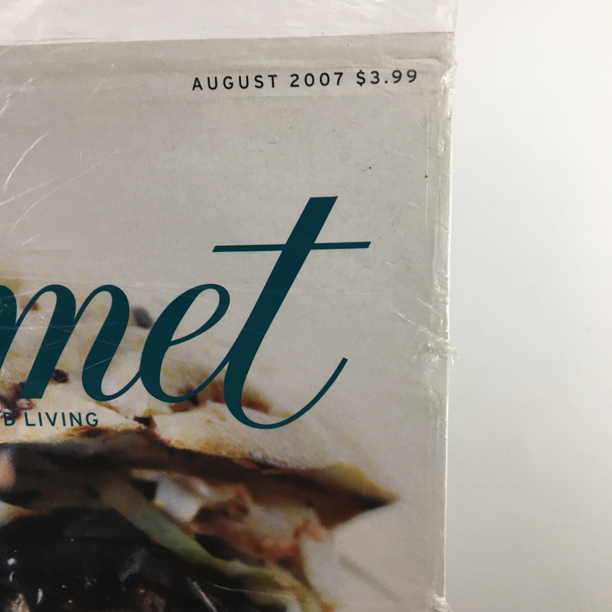 Close-up of the Gourmet Magazine August 2007 title, showcasing the price of $3.99 and the magazine's dedication to good living.