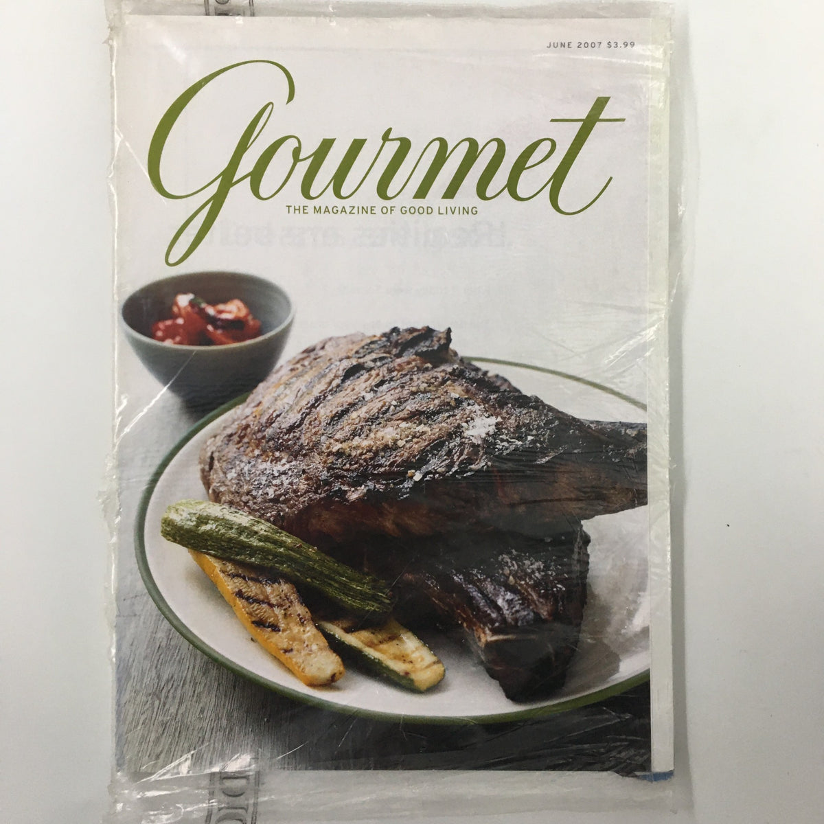Gourmet Magazine June 2007 cover featuring a beautifully grilled steak on a plate with grilled vegetables, showcasing outdoor cooking expertise.