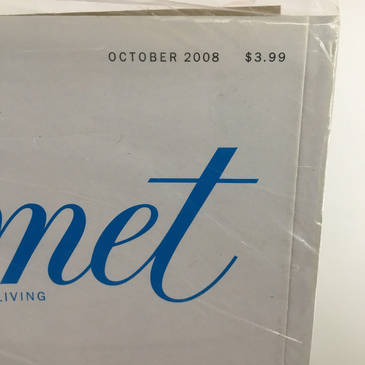 Close-up of the top corner of Gourmet Magazine October 2008, highlighting the publication date and price, emphasizing its collectible nature.